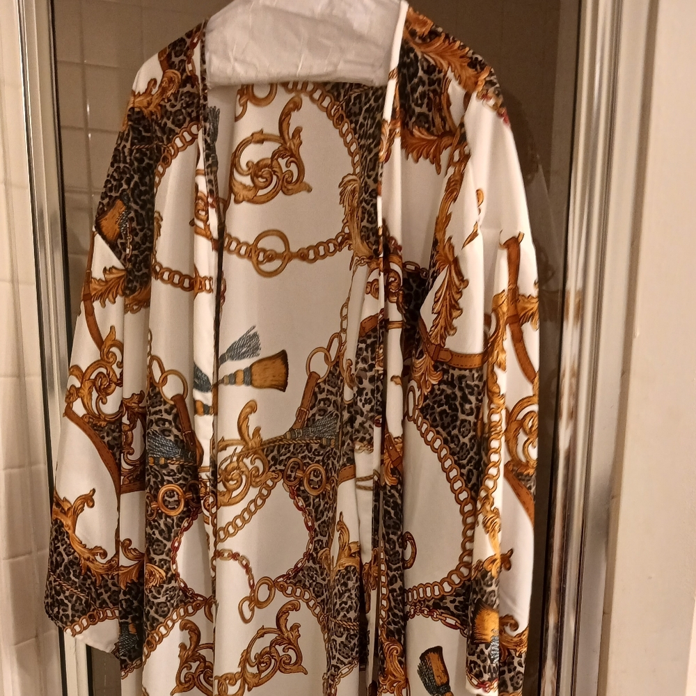 A calve length duster with gold and black print  from Ashley Stewart size 22/24